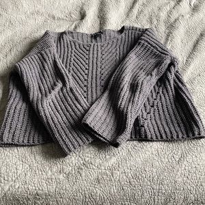 A kids gray sweater very soft.